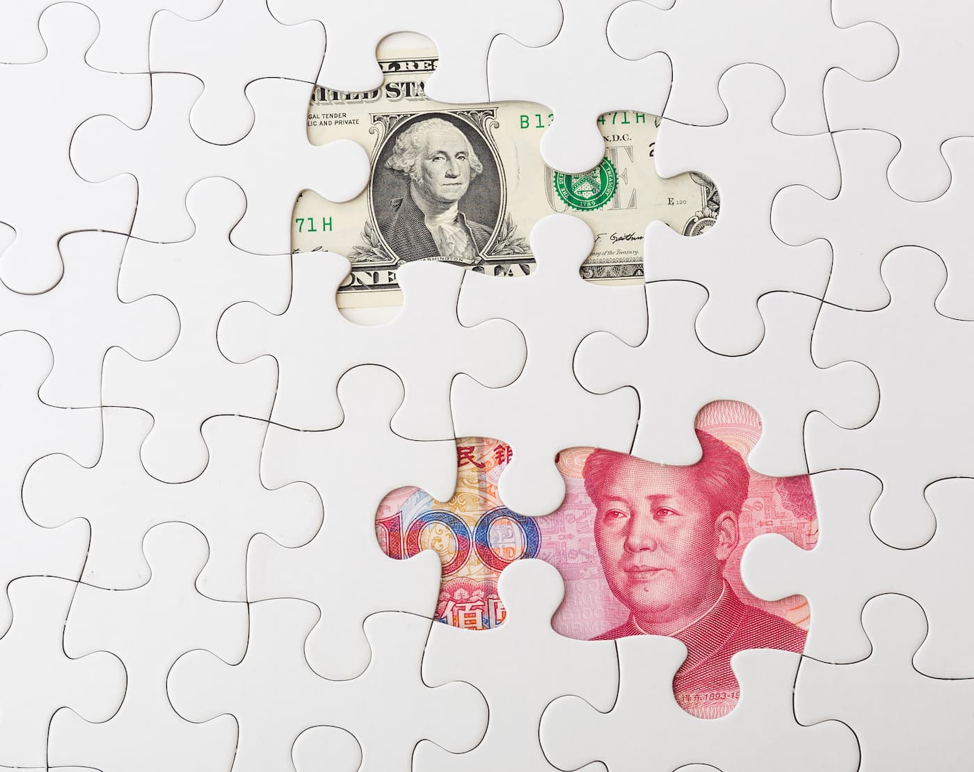 white-puzzle-with-american-dollar-and-chinese-yuan